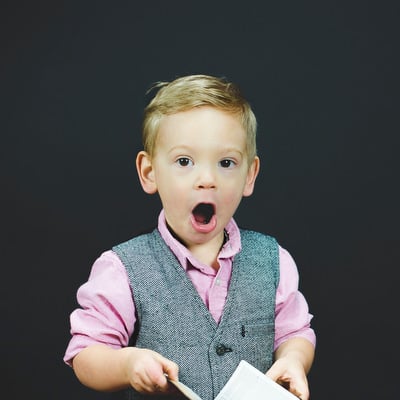 photo of someone looking shocked at the price of an expensive sofa